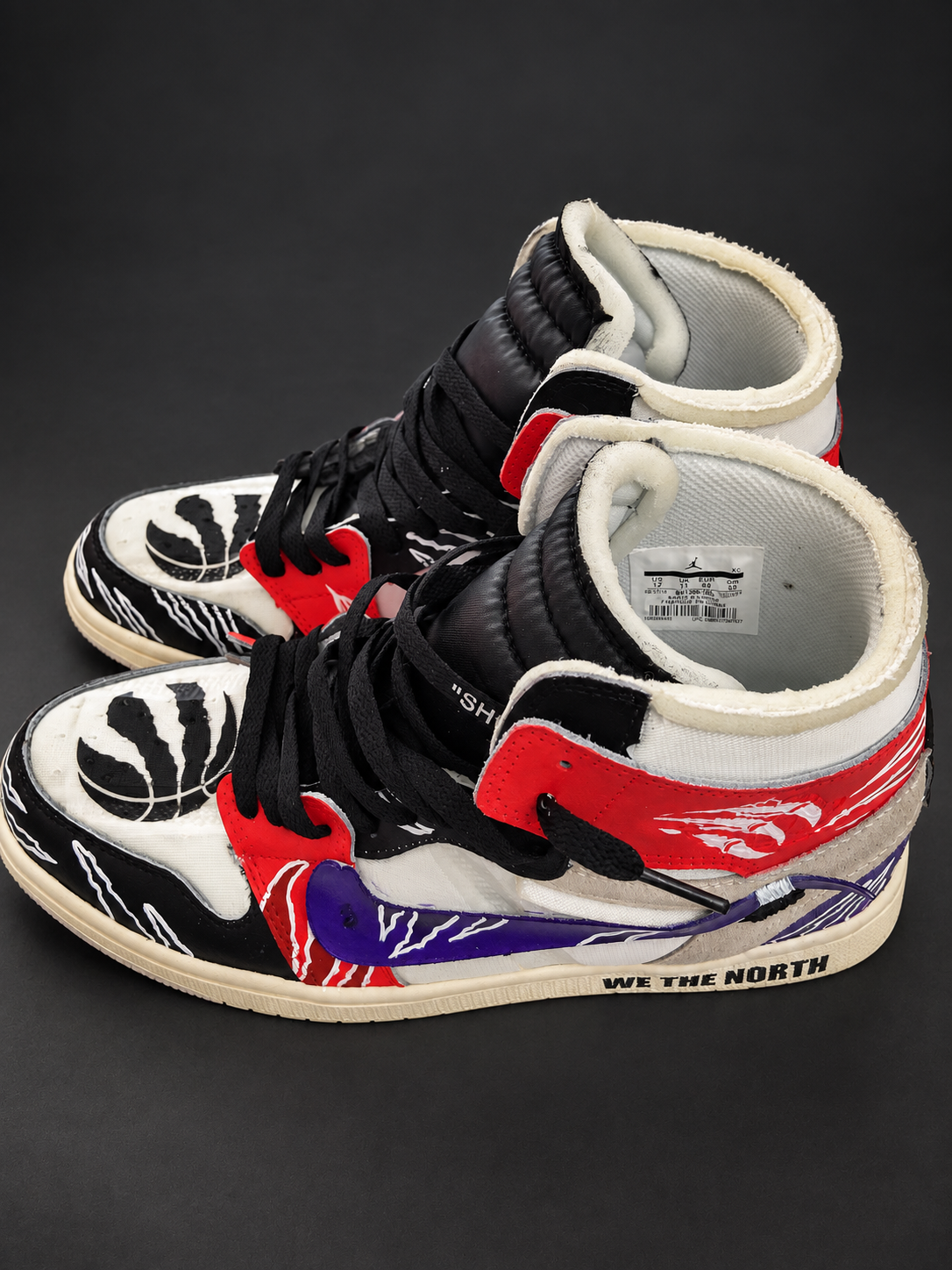 Red, purple, black and white high-tops with claw marks and basketball-inspired artwork. View 1 of 4.